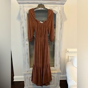 Brown maxi dress with quarter length sleeves.